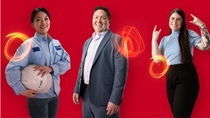 Three diverse BASF employees, one with a safety helmet, one in a suit, and an employee in casual work attire, stand confidently on a red background, connected by glowing light trails that represent their impact as Change Makers.