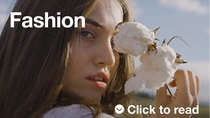 Woman with cotton plant  Woman with cotton plant