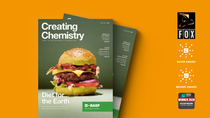 Cover of the Creating Chemistry magazine lies on a colored background