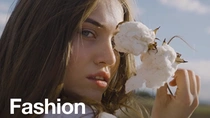 Woman with cotton plant  Woman with cotton plant