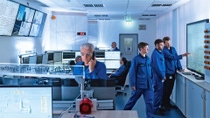 Different people work in a modern control station Different people work in a modern control station