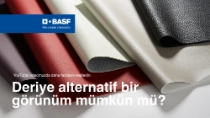 Birkaç farklı renkte (kırmızı, gri, beyaz, siyah) ve deri benzeri görünüme sahip malzeme numuneleri üst üste katmanlanmıştır. Metinde şu yazmaktadır: „İnek olmadan deri görünümü?“ Birkaç farklı renkte (kırmızı, gri, beyaz, siyah) ve deri benzeri görünüme sahip malzeme numuneleri üst üste katmanlanmıştır. Metinde şu yazmaktadır: „İnek olmadan deri görünümü?“