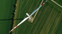 Photo of a wind mill from bird's perspective