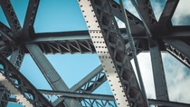 Bridge frame closeup on blue sky background. Horizontal toned image Bridge frame closeup on blue sky background. Horizontal toned image