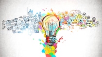 Creative and colorful light bulb sketch and business plan icons drawn on concrete wall. Concept of bright idea