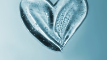 Transparent gel with bubbles close-up. Smear of face gel cream. The texture of gel cream. A sample of a cosmetic product. Antibacterial gel. Transparent gel with bubbles close-up. Smear of face gel cream. The texture of gel cream. A sample of a cosmetic product. Antibacterial gel.