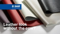 Several material samples in different colors (red, grey, white, black) with a leather-like appearance are layered on top of each other. The text reads: "Leather look without the cow?" Several material samples in different colors (red, grey, white, black) with a leather-like appearance are layered on top of each other. The text reads: "Leather look without the cow?"