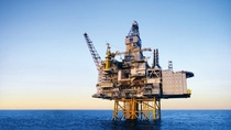 Oil production building in the middle of the water  Oil production building in the middle of the water