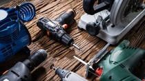Various Power Tools Laying On Wooden Desk Various Power Tools Laying On Wooden Desk