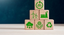 Net zero carbon emissions and carbon neutral concept. Wooden cubes with net zero icons of renewable energy, co2 emissions reduction, green production and waste recycling.