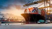 crane loading cargo container from truck to container ship in the international terminal logistic sea port concept freight shipping by ship  crane loading cargo container from truck to container ship in the international terminal logistic sea port concept freight shipping by ship