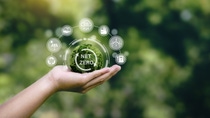 Net zero icon and carbon neutral concept in the hand for net zero greenhouse gas emissions target Climate neutral long term strategy on a green background. Net zero icon and carbon neutral concept in the hand for net zero greenhouse gas emissions target Climate neutral long term strategy on a green background.