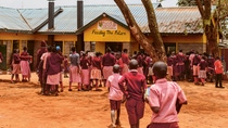 The students are queuing to pick up their lunch from the Food4Education kitchen.  The students are queuing to pick up their lunch from the Food4Education kitchen.