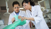 Mohamed Bouguettaya (left) and Wei Leng (right), lab managers, check the quality of a rain boot made of polyurethane. Polyurethane footwear materials offer processing advantages in combination with excellent physical properties. The high flexibility over a broad temperature range is a clear advantage in comparison for example with rubber. Polyurethane can be combined with other materials, allowing a variety of choices of designs and styles for customers.