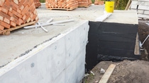 Waterproofing house foundation with  bitumen and styrofoam rigid foam insulation against water leaking. Waterproofing house foundation with  bitumen and styrofoam rigid foam insulation against water leaking.