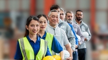 Diverse group of employees standing in a row