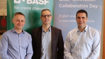 Three people standing in front of BASF banners.jpg Three people standing in front of BASF banners.jpg