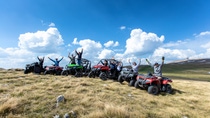 Friends driving off-road with quad bike or ATV and UTV vehicles Friends driving off-road with quad bike or ATV and UTV vehicles