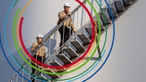 Two engineers climbing up a staircase Two engineers climbing up a staircase