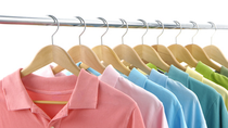 Line of clothes hanging on a silver pole