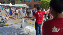 BASF team members from the four South Carolina sites conduct a live demonstration of the elephant toothpaste experiment during the iMAGINE Upstate Festival in Greenville, South Carolina.