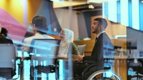 Person in wheelchair in a meeting
