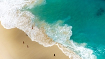 Aerial view of waves at Kelingking beach in Nusa Penida, Bali, Indonesia.