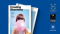 Cover of the Creating Chemistry magazine lies on a colored background