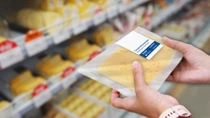 Pre-packaged cheese in a grocery store. Pre-packaged cheese in a grocery store.