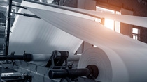Close up from a fabric rolling machine. Close up from a fabric rolling machine.