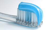 Tooth brush with blue toothpaste