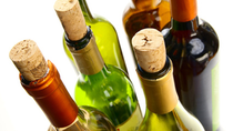 Multiple wine bottles with corks
