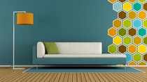 Living room with hexagon decorations on wall and modern sofa - 3d rendering
 Living room with hexagon decorations on wall and modern sofa - 3d rendering