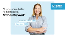 Eine Frau in einem blauen Shirt vor einem blauen Hintergrund mit überkreuzten Armen lächelt in die Kamera, Aufschrift "All for your products. All in one place. MyIndustryWorld"
