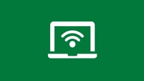 White icon of a laptop with a Wi-Fi symbol on a green background, representing flexible work and remote connectivity.
