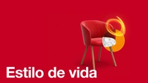 Uma poltrona vermelha de couro com pernas de madeira sobre fundo vermelho, com um redemoinho de luz laranja e um elemento circular ao lado do braço. O texto diz: "Estilo de vida."