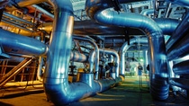 Equipment, cables and piping as found inside of a industrial power plant Equipment, cables and piping as found inside of a industrial power plant
