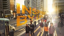 People walking down busy city street with text "Inspired by life" People walking down busy city street with text "Inspired by life"