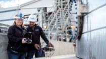 Title of BASF Factbook: Drones and digitalization are increasingly used as part of routine maintenance procedures. Courtney Buell, Engineering Associate, and Philip Reyes, Drone & Robotics Specialist, prepare to inspect a vessel in the carboxy plant at BASF’s Verbund site in Geismar, Louisiana. In this way, the need for personnel to enter a confined space is avoided.