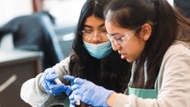 girls conducting an experiment as part of basf's kids lab.jpg