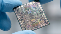 Fingers holding semiconductor chips. Fingers holding semiconductor chips.