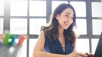 Portrait of smiling beautiful business asian woman with suit working in office desk using computer with copy space. Business people employee freelance online marketing e-commerce telemarketing concept Portrait of smiling beautiful business asian woman with suit working in office desk using computer with copy space. Business people employee freelance online marketing e-commerce telemarketing concept