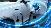 EV Car or Electric vehicle at charging station with the power cable supply plugged in on blurred nature with blue energy power effect. Eco-friendly sustainable energy concept. EV Car or Electric vehicle at charging station with the power cable supply plugged in on blurred nature with blue energy power effect. Eco-friendly sustainable energy concept.