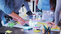 Close up ux developer and ui designer use augmented reality app brainstorming about mobile interface wireframe design on desk at modern office.Creative digital development agency Close up ux developer and ui designer use augmented reality app brainstorming about mobile interface wireframe design on desk at modern office.Creative digital development agency