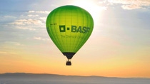 Beautiful landscape with green hot air ballon with BASF logo  Beautiful landscape with green hot air ballon with BASF logo