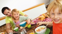 Happy family having breakfast together  Happy family having breakfast together