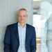 The pictures is a portrait of Dr Markus Kamieth, Chairman of the Board of Executive Directors of BASF, in a blue suit with a blue shirt The pictures is a portrait of Dr Markus Kamieth, Chairman of the Board of Executive Directors of BASF, in a blue suit with a blue shirt