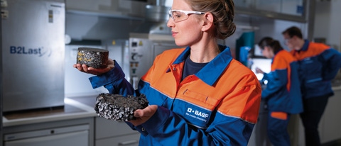 With B2Last®, BASF has developed an innovative bitumen additive that combines both asphalt performance and sustainability: Temperature-reduced paving with a high recycled asphalt content is made possible through the use of B2Last®, while guaranteeing consistent workability. This creates significantly lower bitumen and CO2 emissions compared to standard applications, while the asphalt resistance is also increased, thereby extending the life span of the road. Anne Holzum, chemical laboratory technician, checks the extent to which the Marshall test specimens have deformed as a result of loading in a cyclic compression test. In her right hand, Anne Holzum holds a test specimen with the bitumen additive B2last. In her left hand she holds a specimen without B2last. With B2Last®, BASF has developed an innovative bitumen additive that combines both asphalt performance and sustainability: Temperature-reduced paving with a high recycled asphalt content is made possible through the use of B2Last®, while guaranteeing consistent workability. This creates significantly lower bitumen and CO2 emissions compared to standard applications, while the asphalt resistance is also increased, thereby extending the life span of the road. Anne Holzum, chemical laboratory technician, checks the extent to which the Marshall test specimens have deformed as a result of loading in a cyclic compression test. In her right hand, Anne Holzum holds a test specimen with the bitumen additive B2last. In her left hand she holds a specimen without B2last.