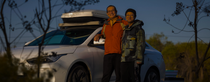 Two man standing in front of a white car. Two man standing in front of a white car.