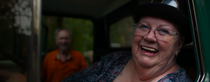Close up of an elderly woman sitting in a green car. Close up of an elderly woman sitting in a green car.